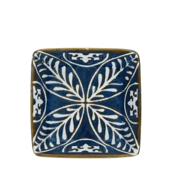 Blue ceramic square dish with white floral pattern interior