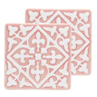 Set of two pink ceramic coaster with embossed pattern.
