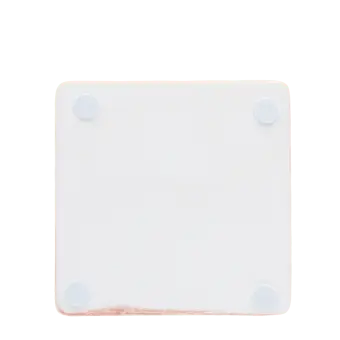 Back of pink ceramic coaster with four corner foam pads to prevent surface scratches.