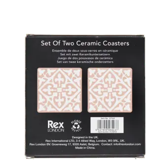 Back of boxed set of two pink ceramic coasters with pattern, branding, and barcode.