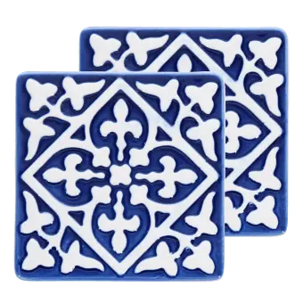 Set of two blue ceramic coaster with embossed pattern.
