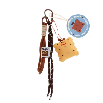 Plush toast bag charm with brown cord strap and metal clip attachment with tag.