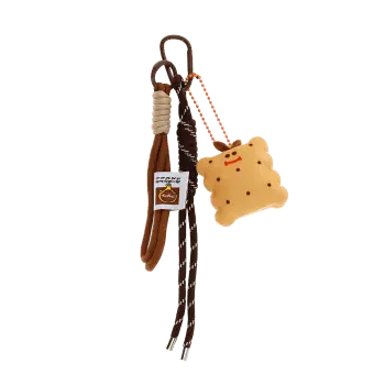Plush toast bag charm with brown cord strap and metal clip attachment