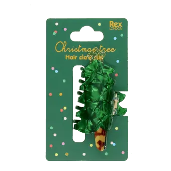 Green Christmas tree-shaped hair claw clip on festive retail packaging.