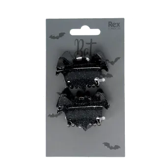 Set of two black bat-shaped hair claw clips on Halloween-themed retail packaging.