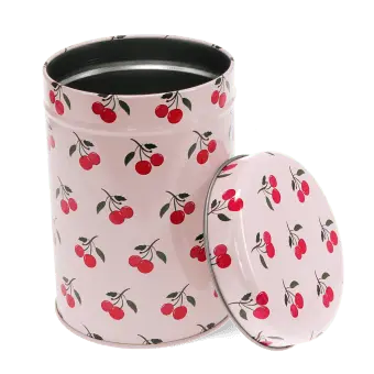 Pink canister tin with open lid, decorated with red cherry pattern