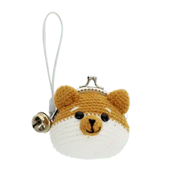 Crochet fox-shaped coin purse with a metal clasp and hanging bell charm.
