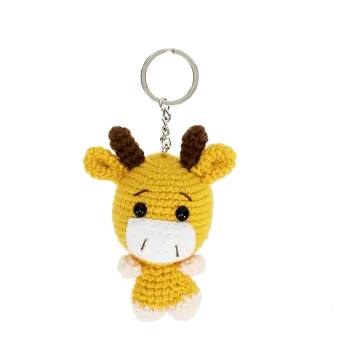 Crochet giraffe keyring with small horns and a silver metal keyring attachment.