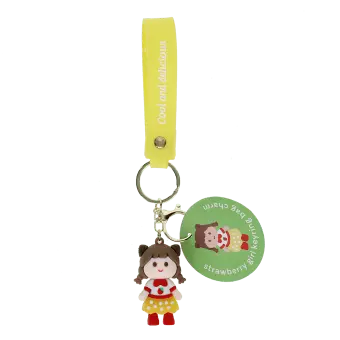 Strawberry girl bag charm with yellow polka dot skirt, silicone wrist strap and keyring with tag.