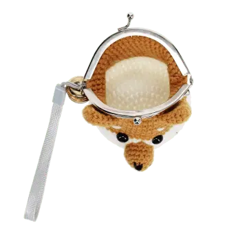 Crochet fox-shaped coin purse with a metal clasp and hanging bell charm with tag.
