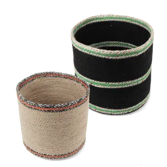 Set of two round jute storage baskets in natural and black.