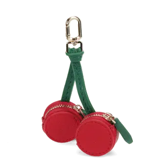 Cherry-shaped coin purse with zip compartments, green strap and gold-tone keychain.