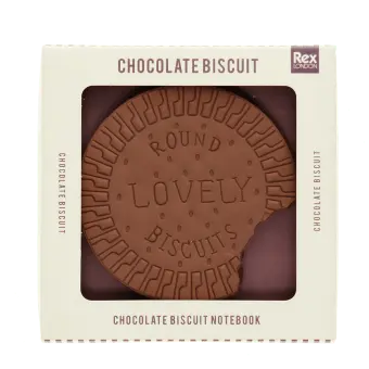 Chocolate biscuit-shaped notebook with bite-mark detail, displayed in retail packaging.