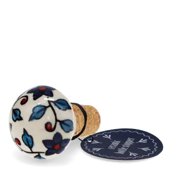 Ceramic and cork bottle stopper with floral and leaf pattern with tag.