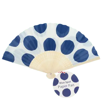  Blue polka dot recycled paper hand fan with cream folding handle and colourful circular pattern.