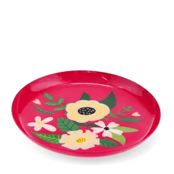 Round pink metal trinket tray with colourful floral design.
