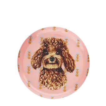 Round metal trinket tray featuring an illustrated brown dog with a decorative pattern.