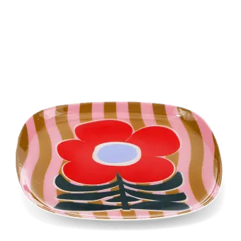 Square metal trinket tray with bold red flower design on a pink striped background.