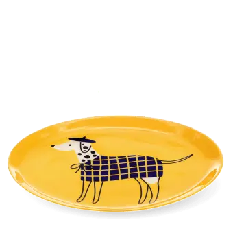 Oval yellow metal tray featuring an illustrated spotted dog wearing a blue checked coat and beret.