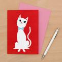 blank red greetings card with white cat print and pink envelope
